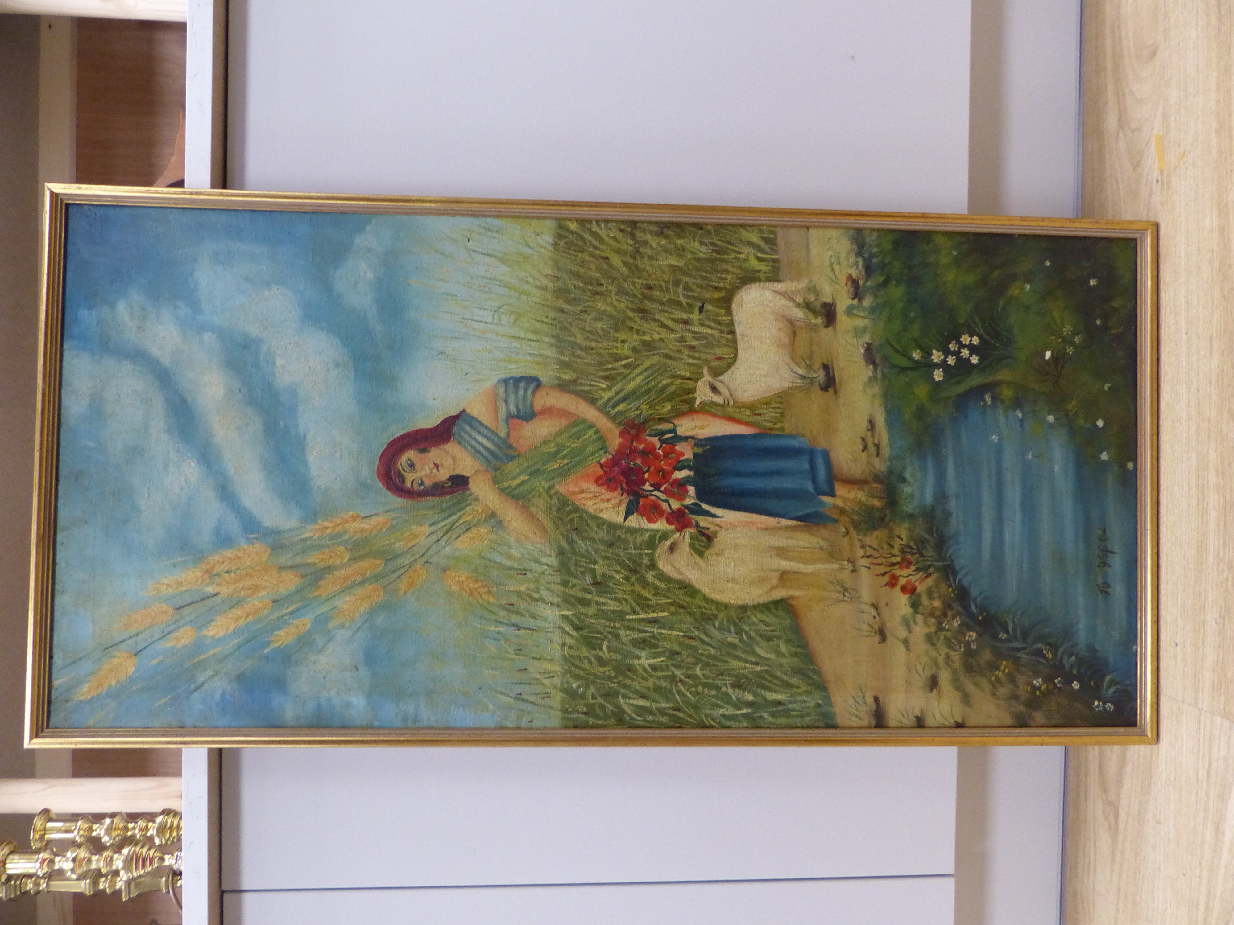 Continental School, oil on canvas, Shepherdess holding corn sheaths in a landscape, inscribed below, 97 x 45cm